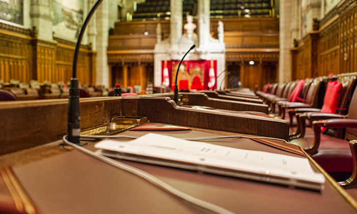 Photo of an empty legislative chamber.