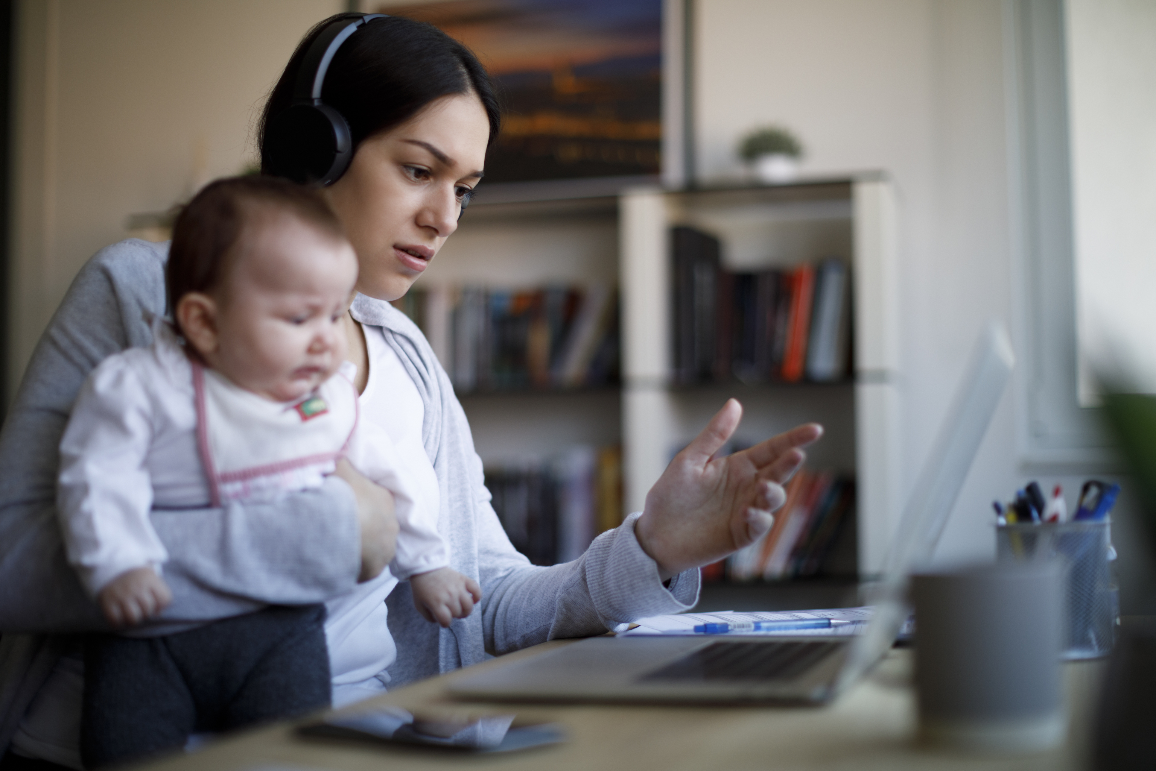 woman with baby in front of a computer