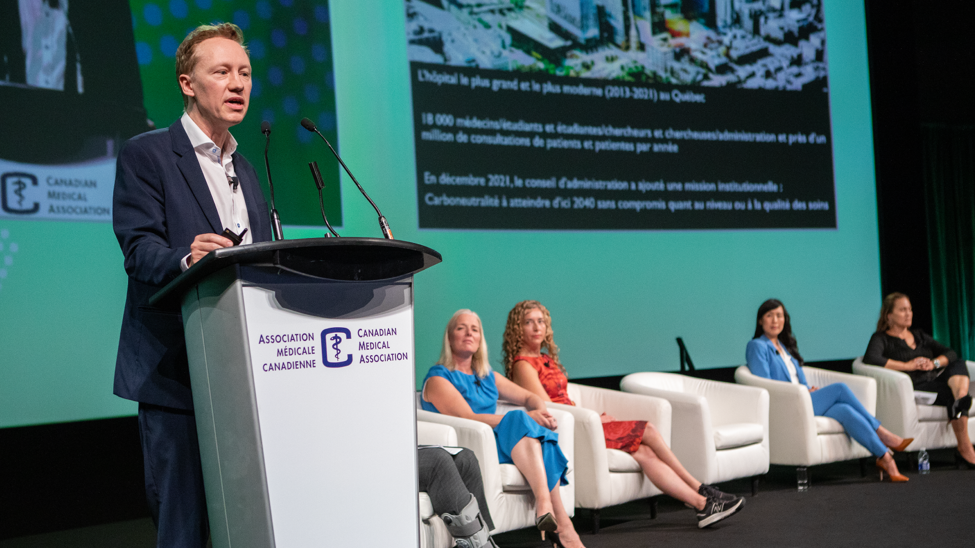 The host and participants of a panel on net-zero, climate-resilient health care at the CMA Health Summit. From left to right: host Adrian Harewood, the Hon. Catherine McKenna, Dr. Courtney Howard, Dr. Stephan Williams, Dr. Melissa Lem and Dr. Ojistoh Horn.